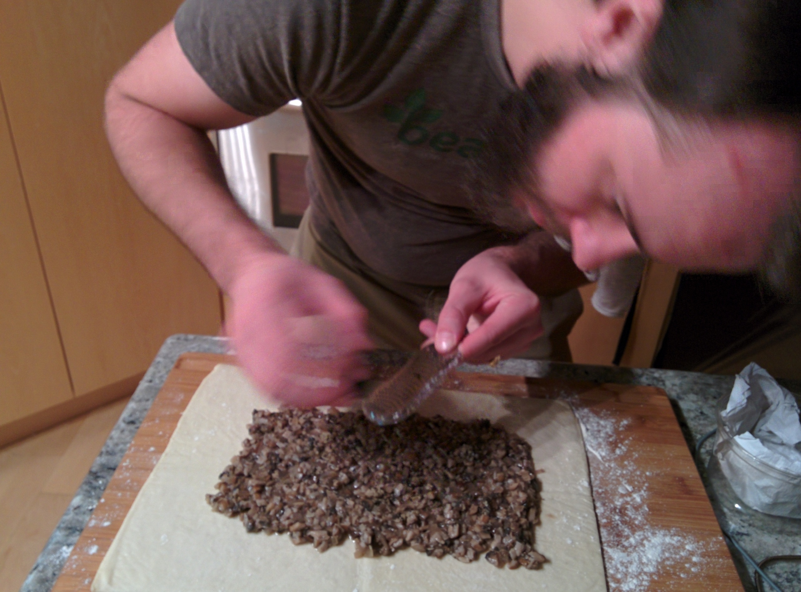 Grating truffle onto the duxelles